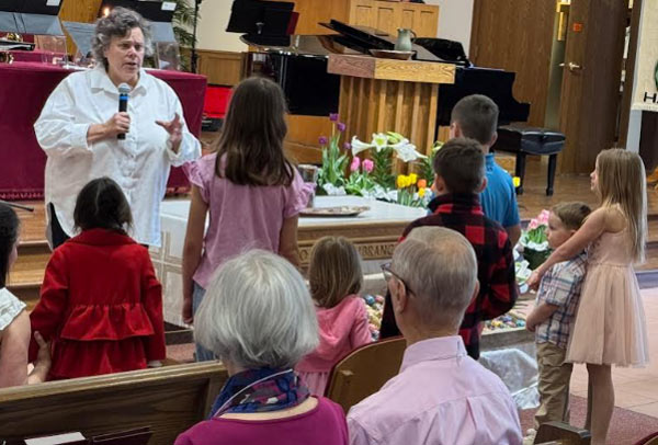 Children in Worship at First Presbyterian Church of Farmington  with leader and back view of children