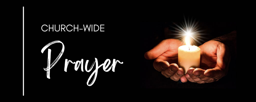 Open Hands with a prayer candle. 