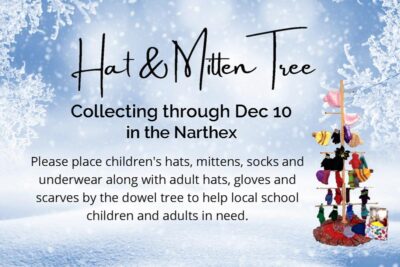 Photo of the hat and mitten tree against a snowy background
